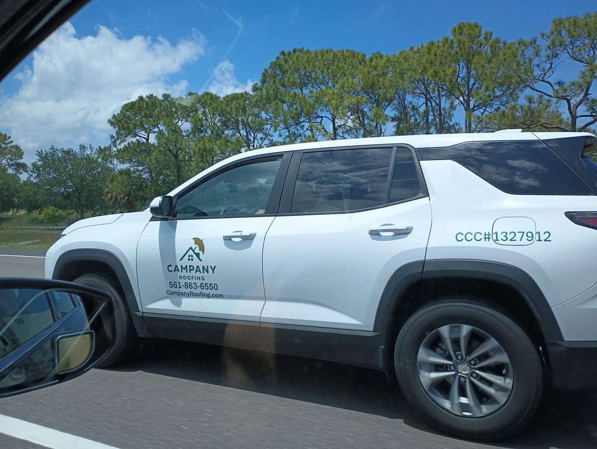 Campany Roofing lettered white SUV on I-95 northbound near Palm Bay Florida