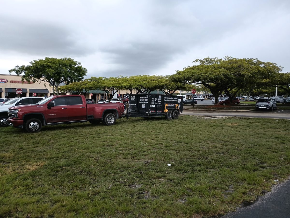 CSI Construction lettered work trailer in Key Foods shopping center parking lot Weston Florida